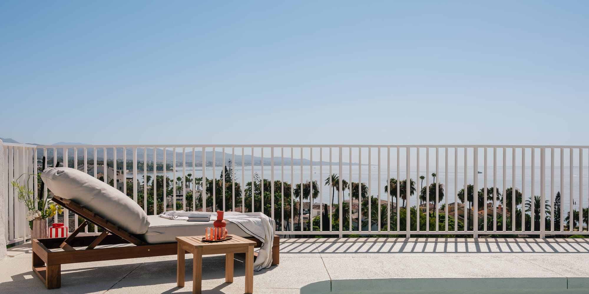 a pool and lounge chair on a deck