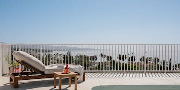 a pool and lounge chair on a deck