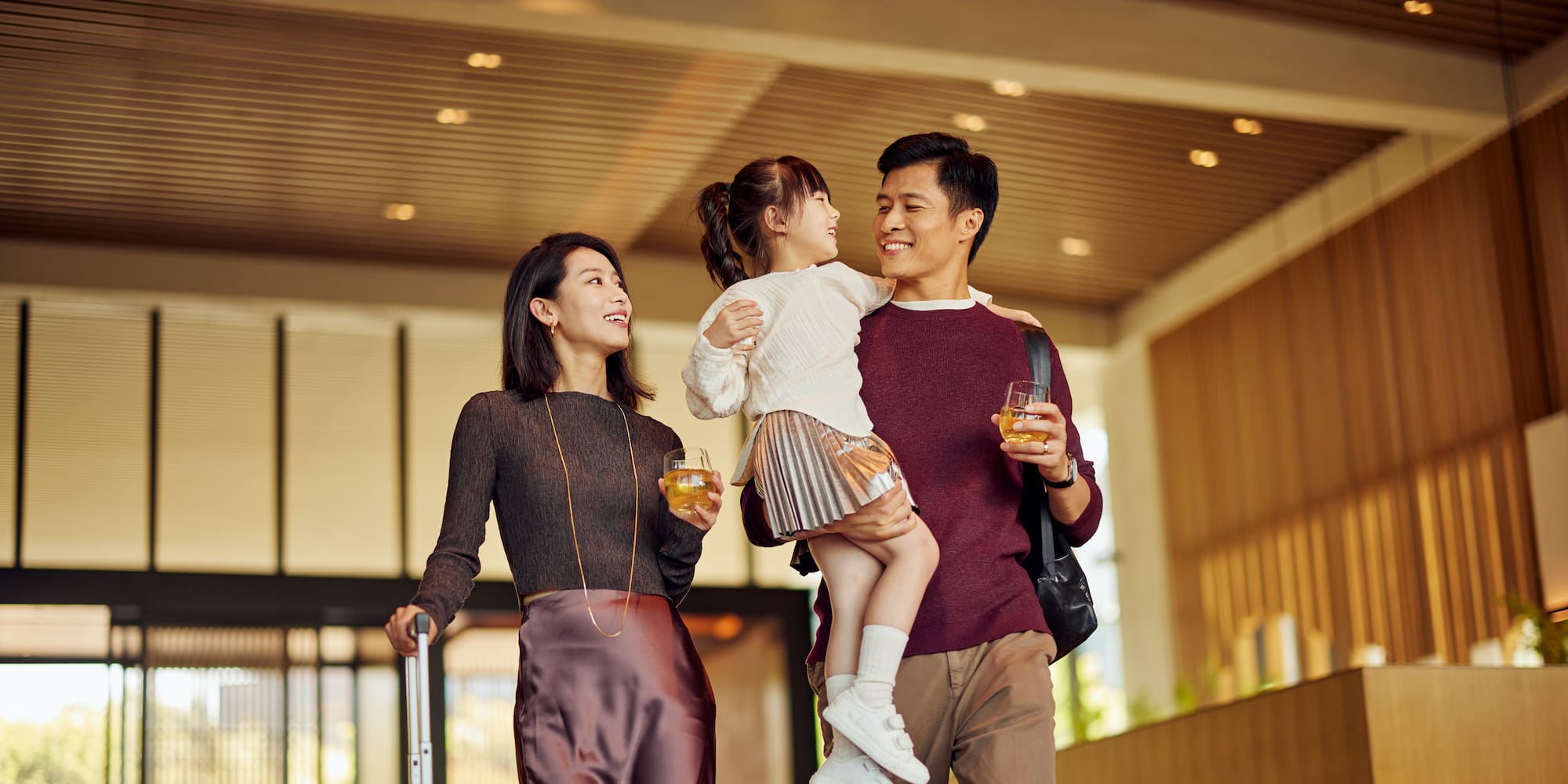 a man and woman holding a child