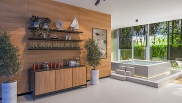 a room with a pool and a wood wall and shelves