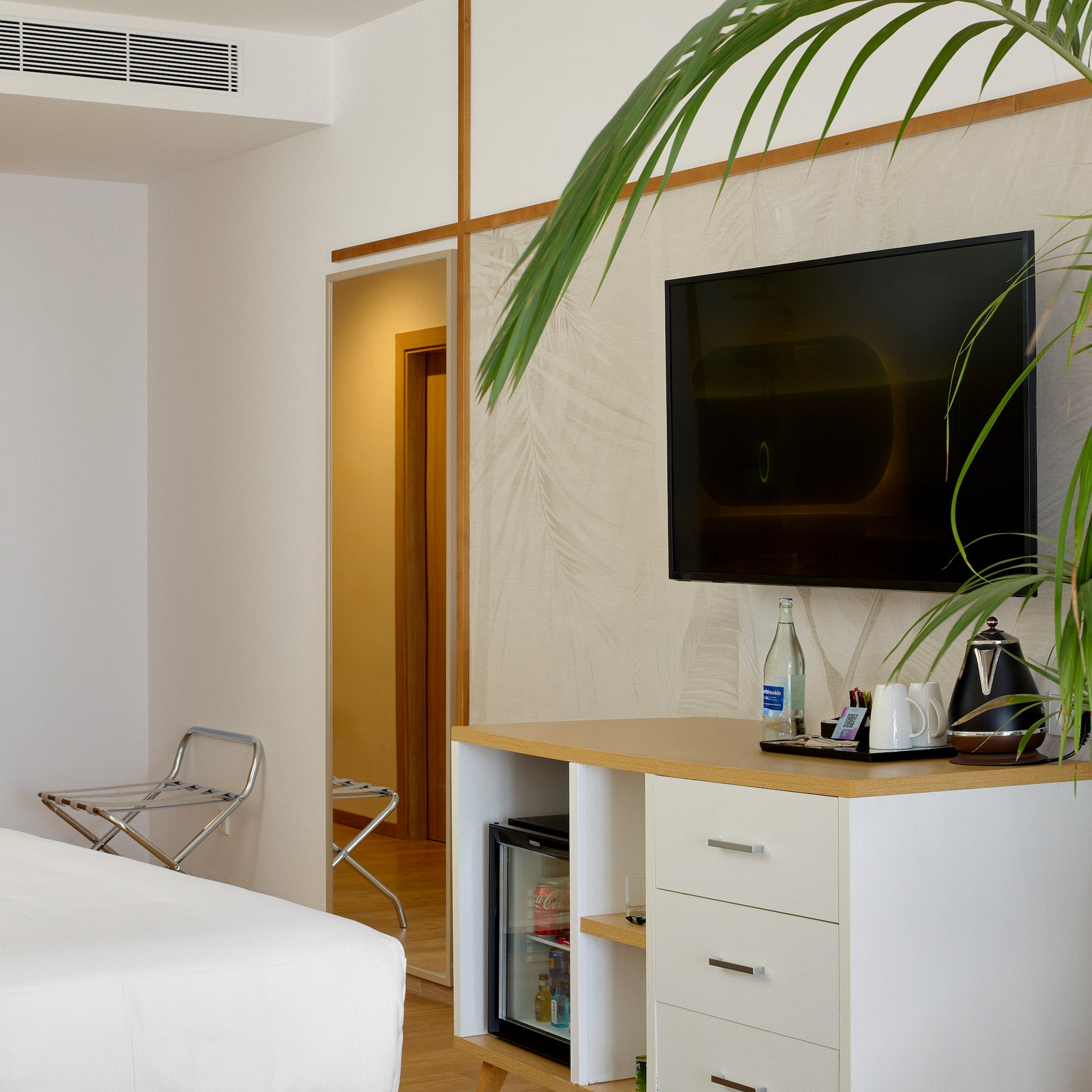 a room with a tv on the wall