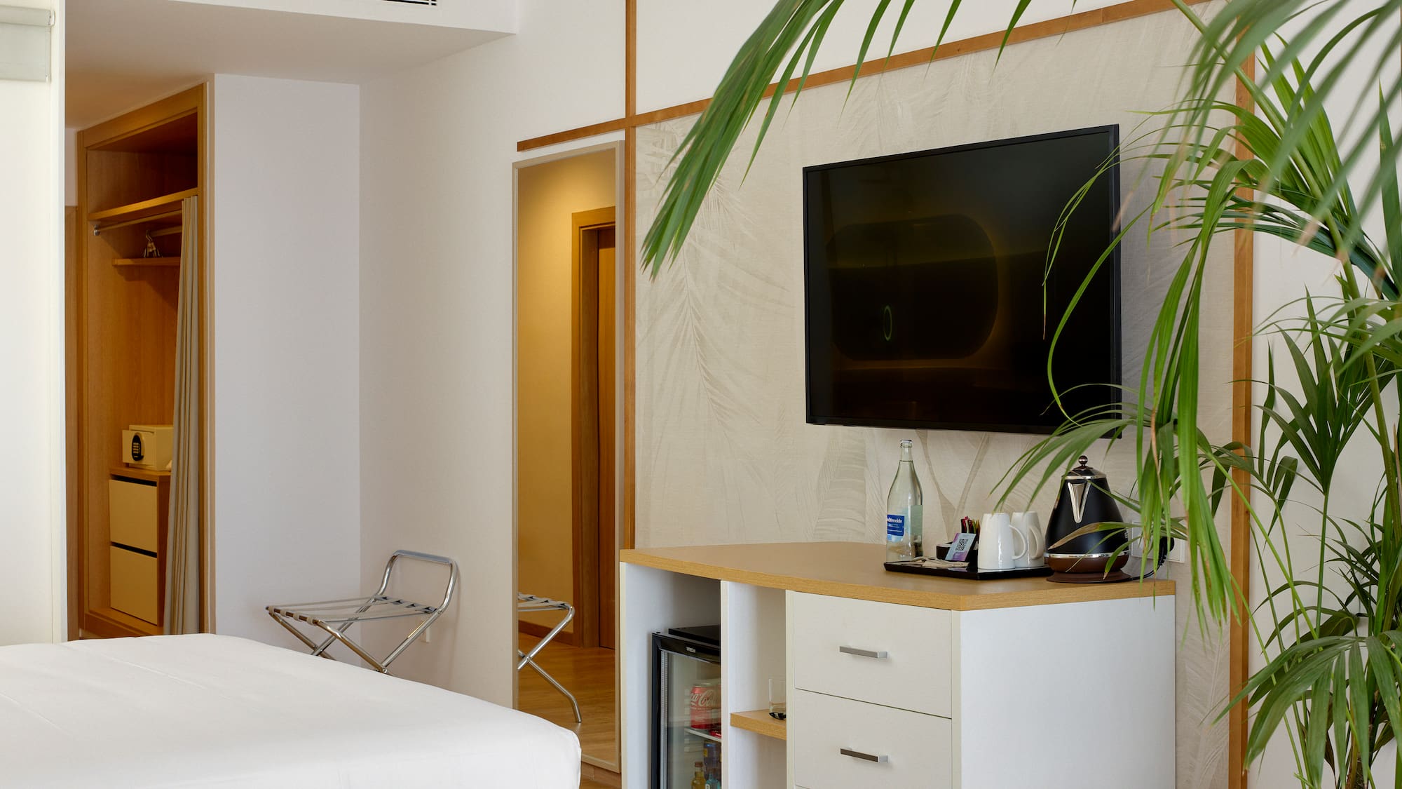 a room with a tv on the wall