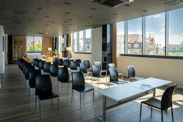 a room with many chairs and tables