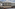 Mim Baqueira Gran Hotel exterior with snow. Mountain ski resort in winter.