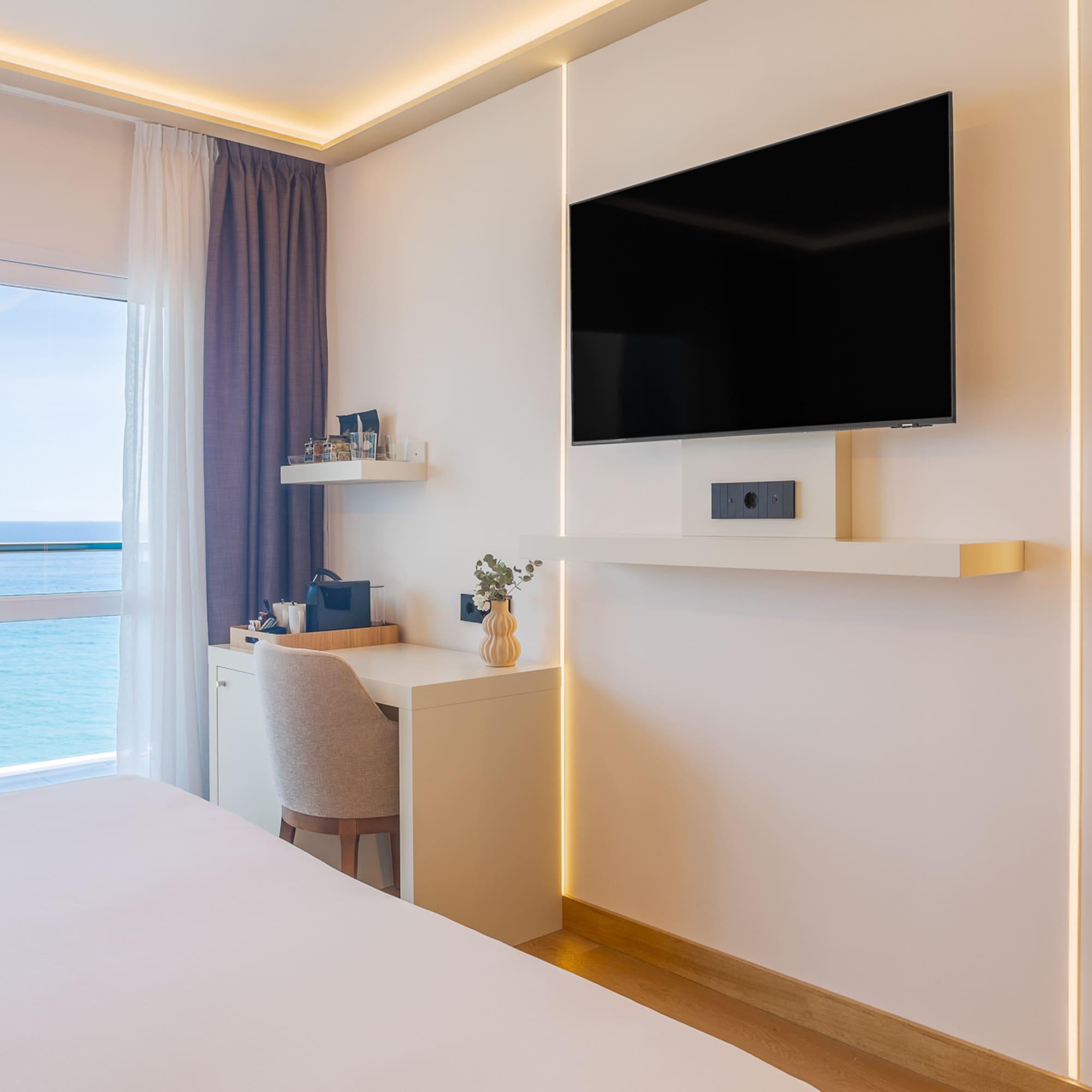 a room with a tv on the wall