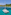 Catamarán de lujo en aguas turquesas del Caribe, con playa y montañas tropicales.