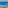 Pebble beach with blue ocean, palm trees, sun loungers, and thatched umbrellas.