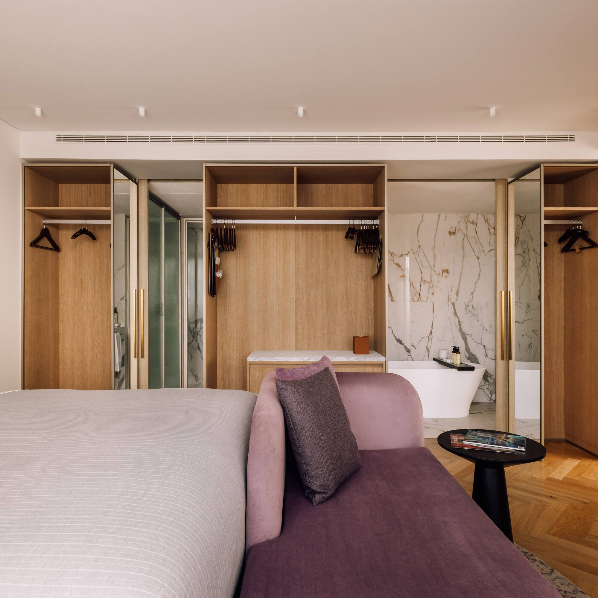 a room with a bed and a bathtub