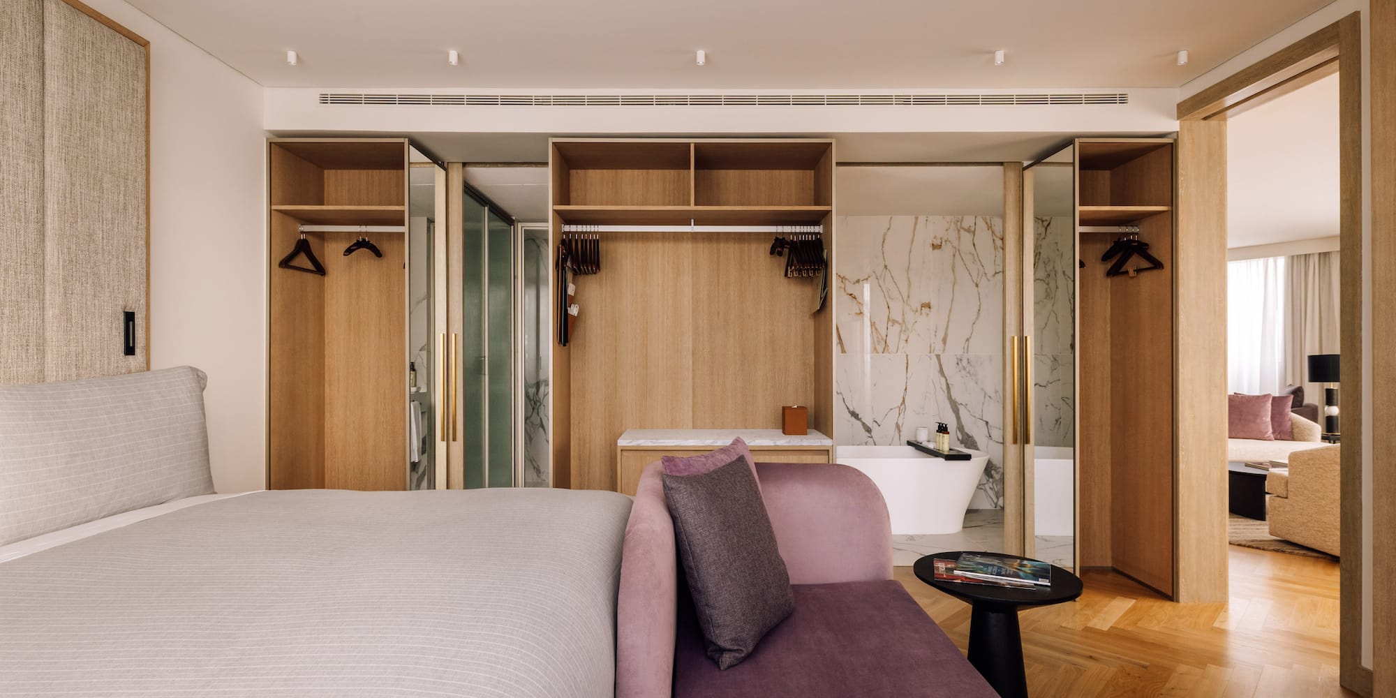 a room with a bed and a bathtub