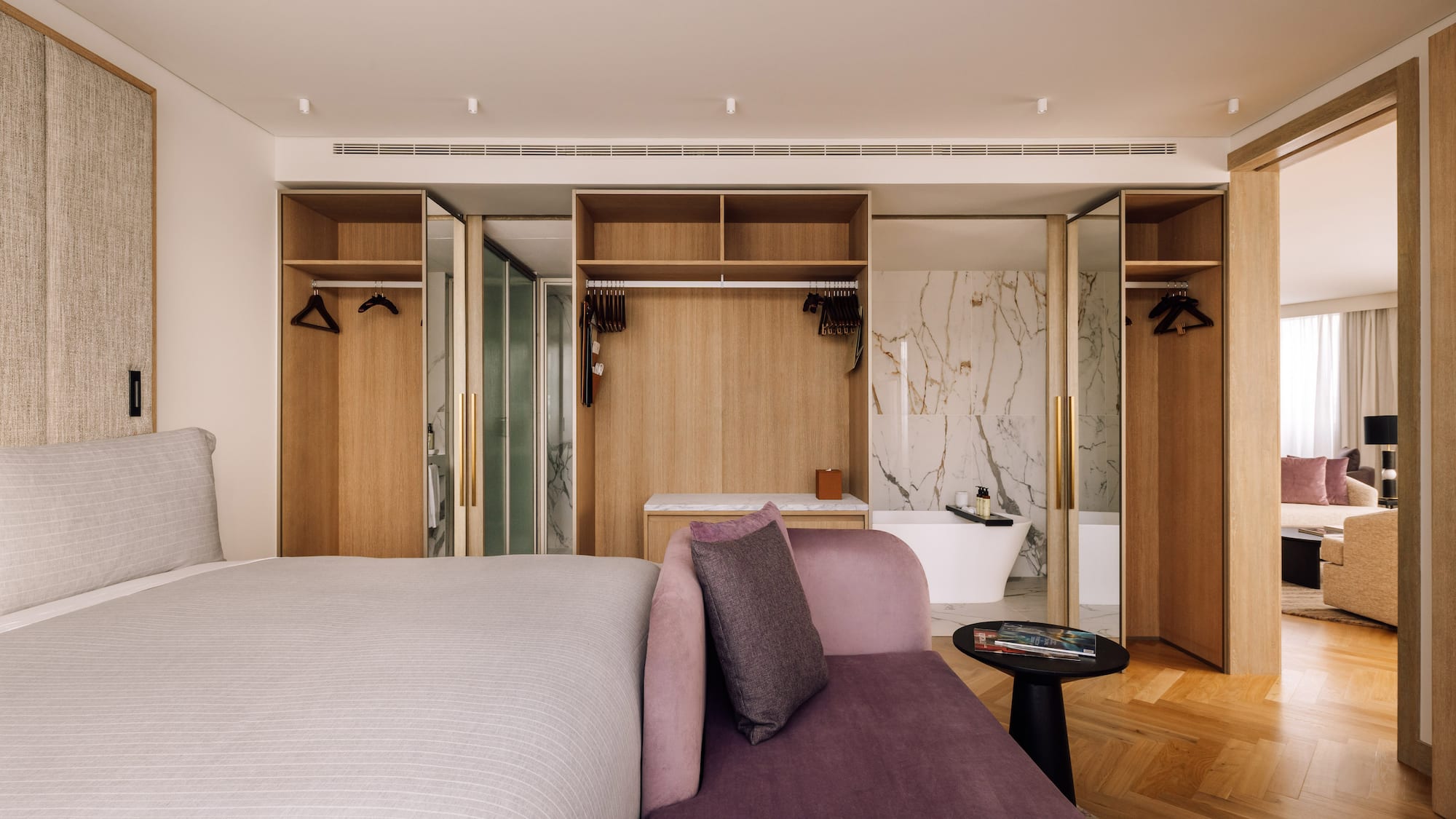 a room with a bed and a bathtub