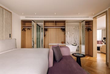 a room with a bed and a bathtub