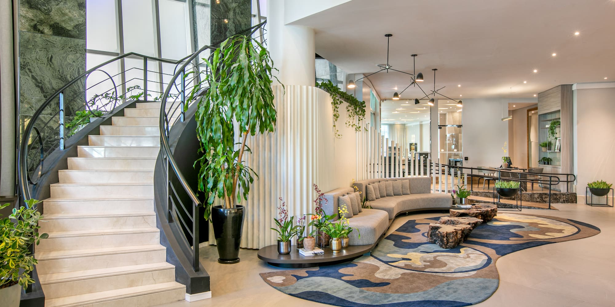 a lobby with a spiral staircase and a couch