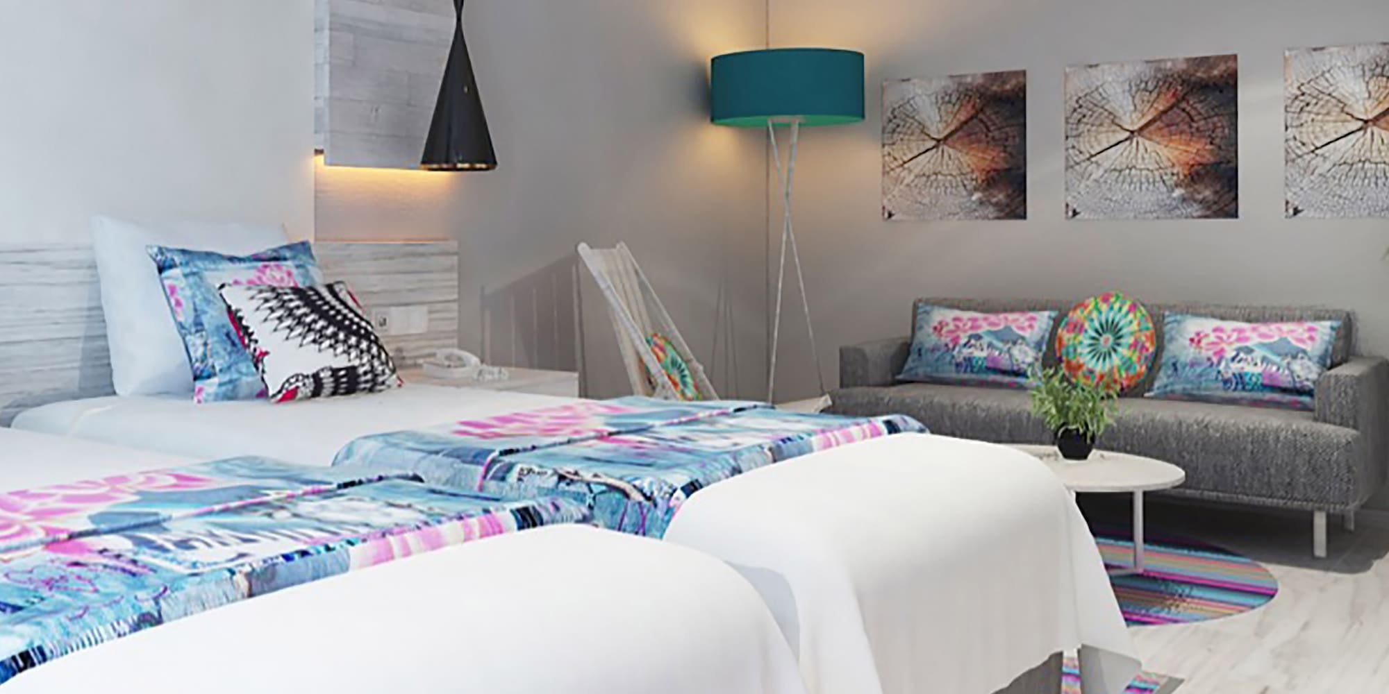 a room with two beds and a couch