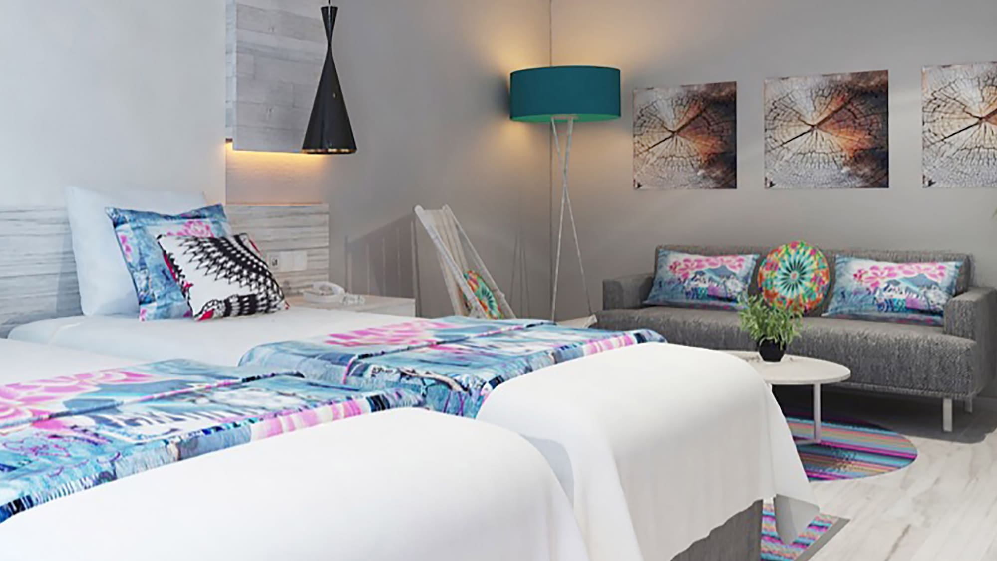 a room with two beds and a couch