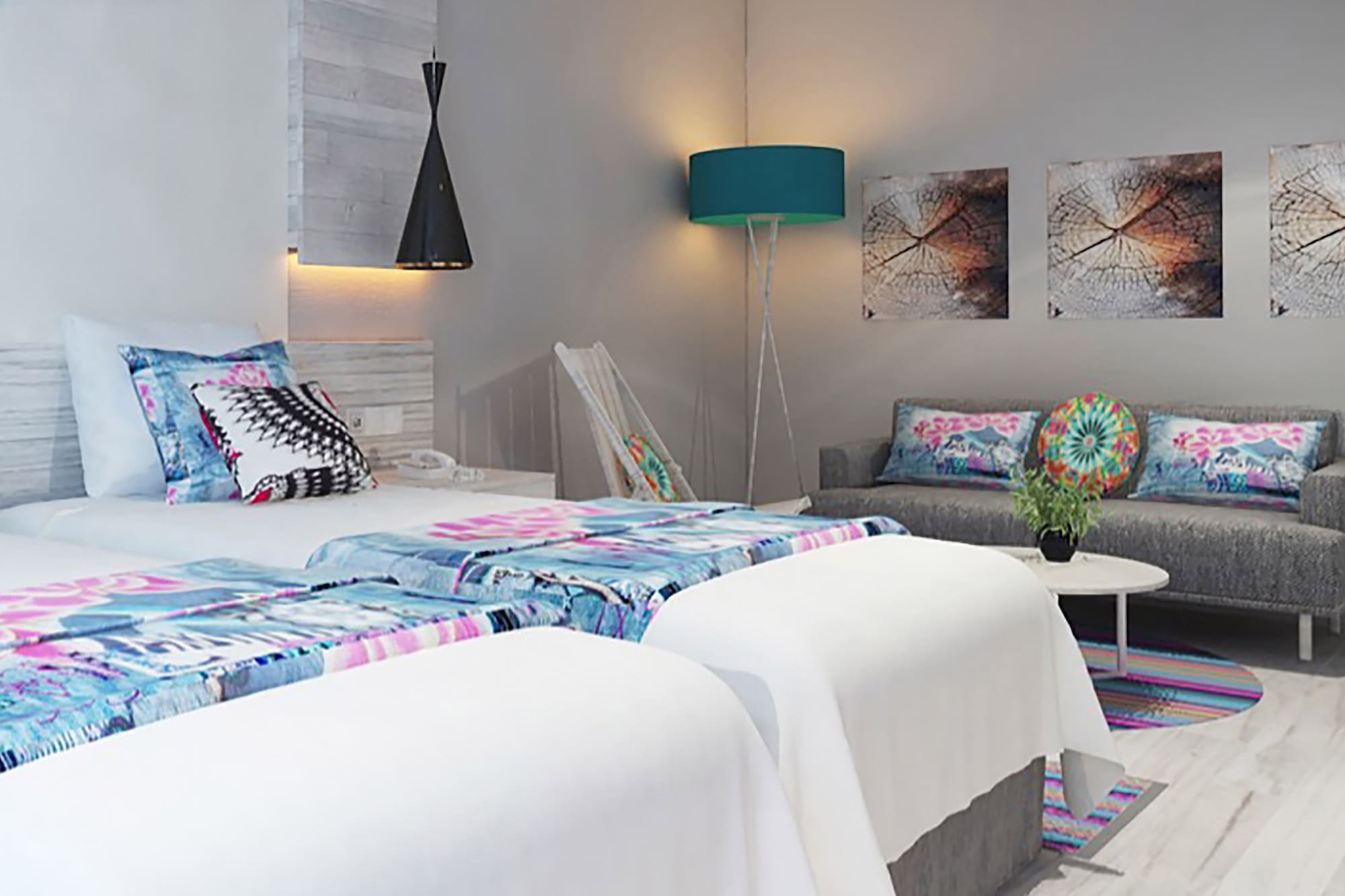 a room with two beds and a couch