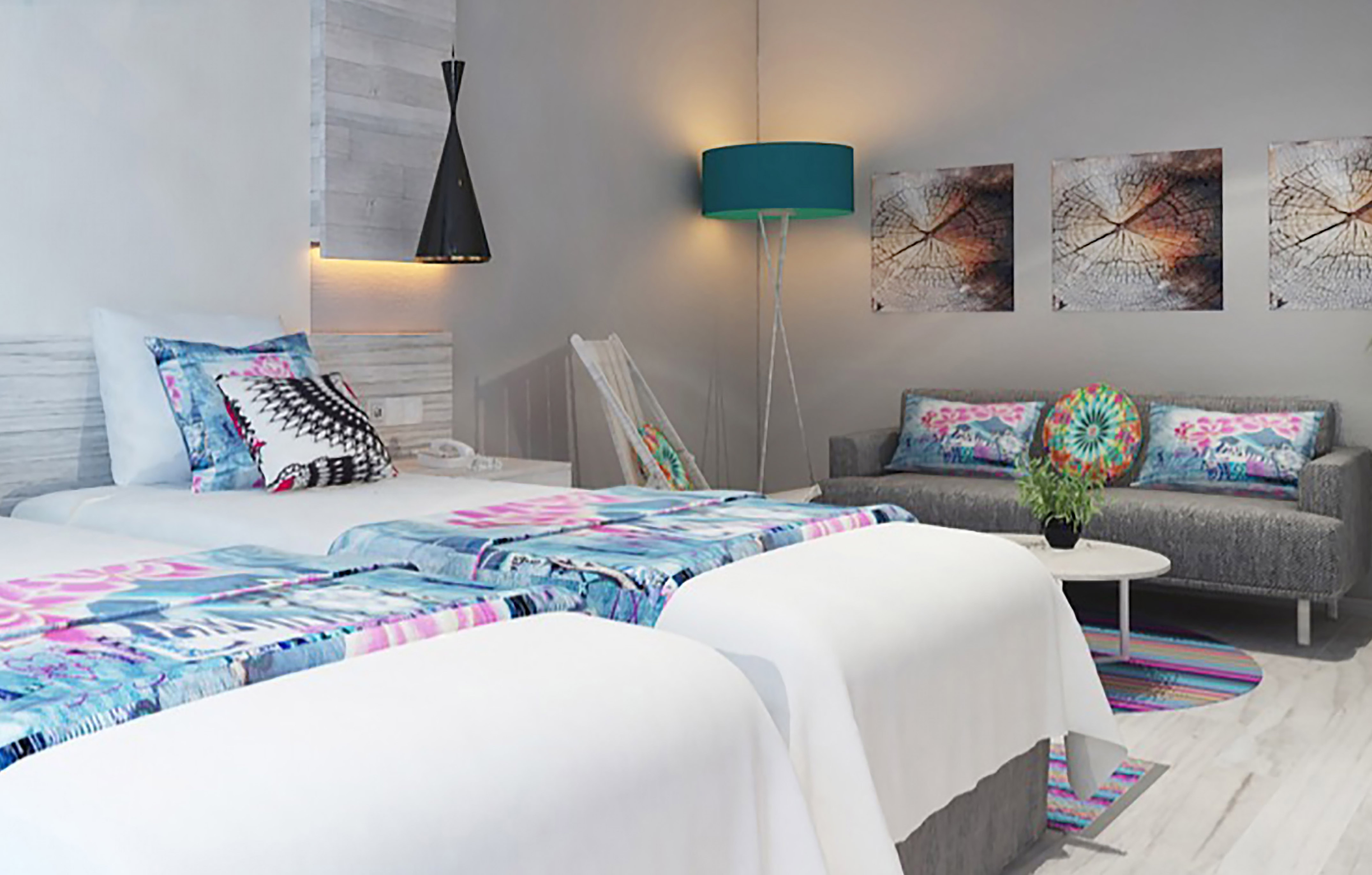 a room with two beds and a couch