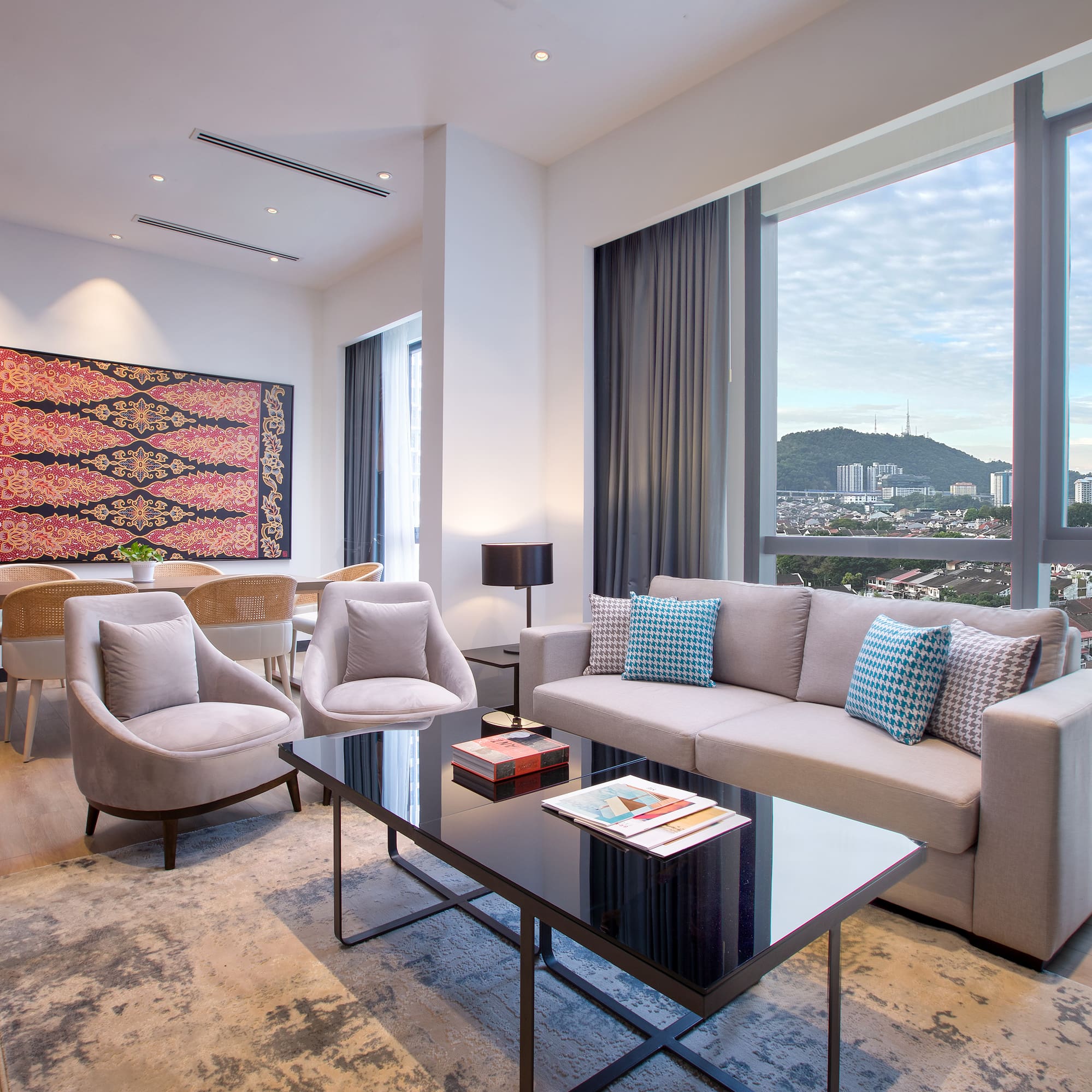 a living room with a couch and chairs