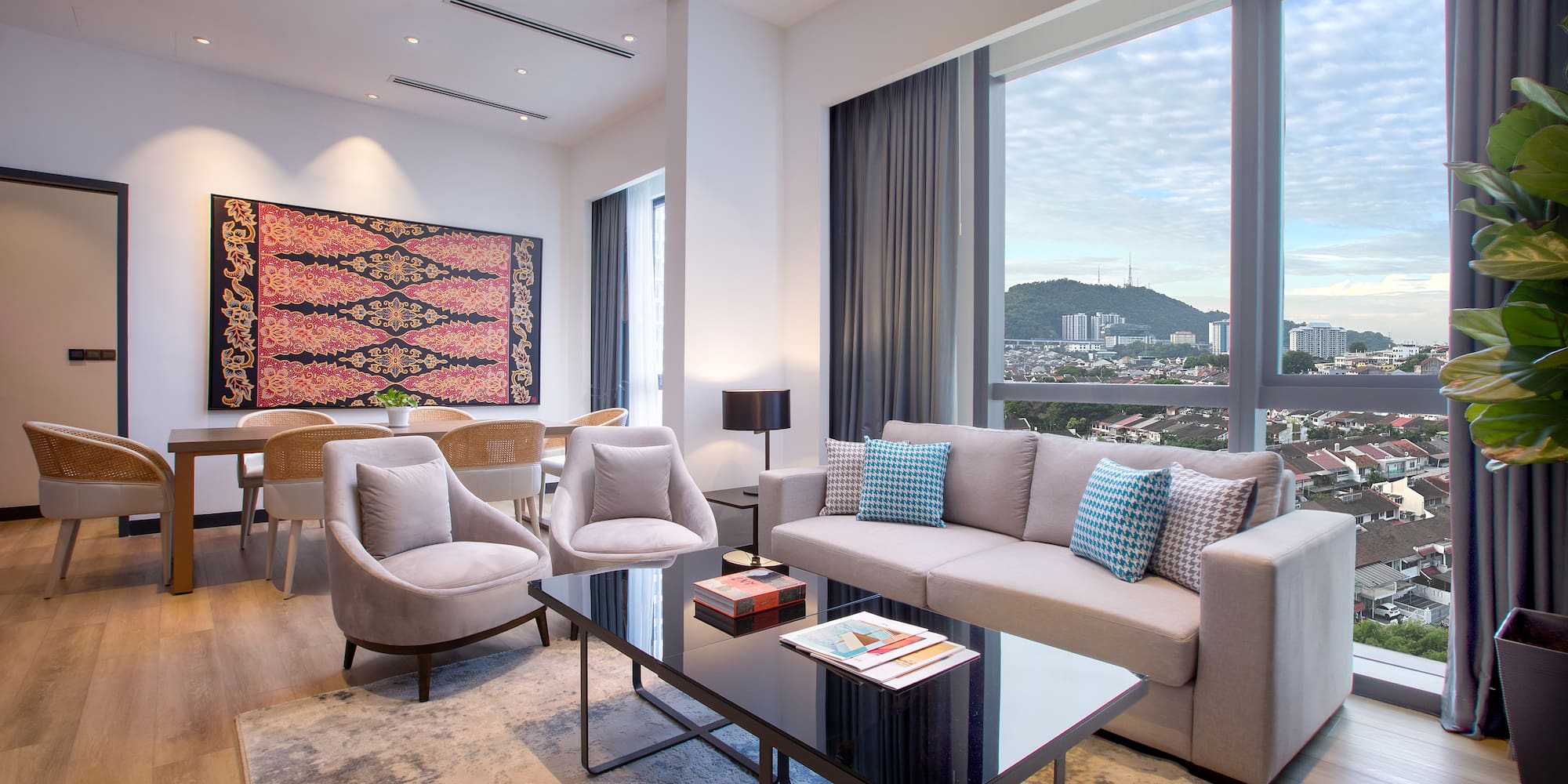 a living room with a couch and chairs