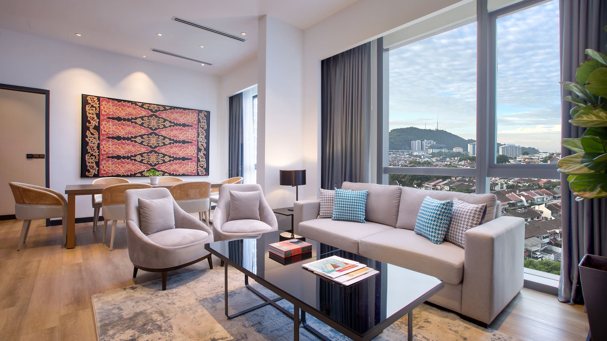 a living room with a couch and chairs