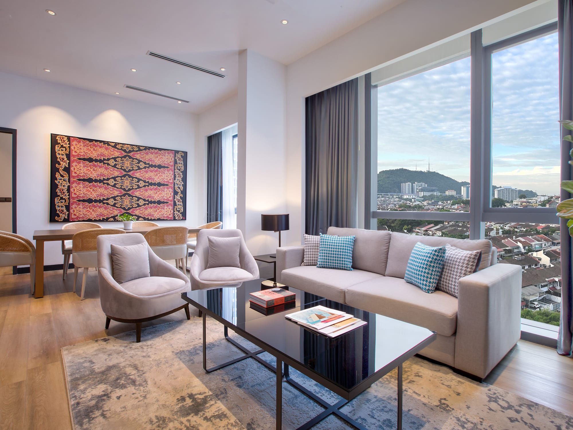 a living room with a couch and chairs