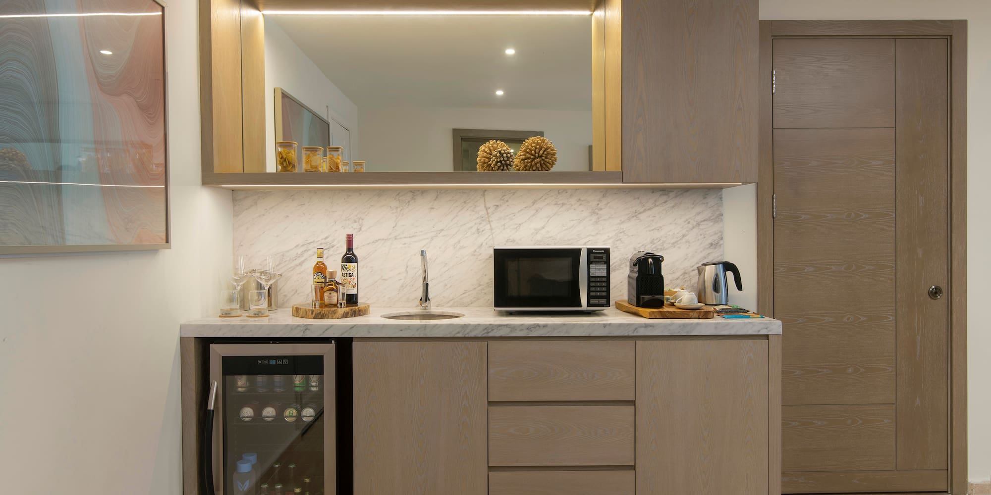 a kitchen with a sink and a refrigerator