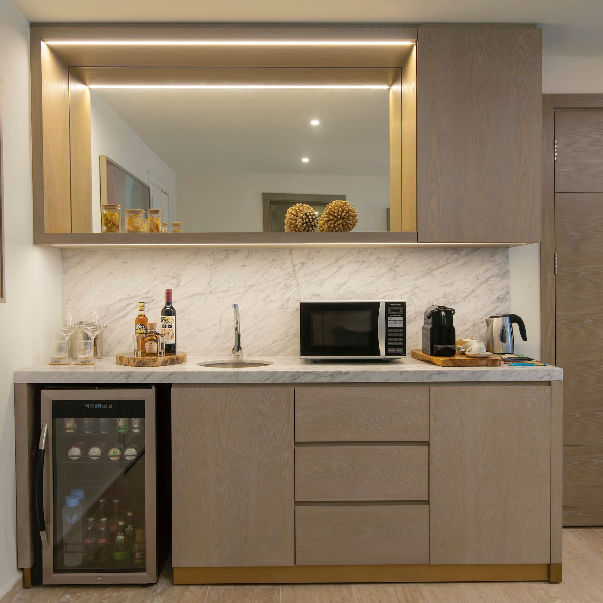 a kitchen with a sink and a refrigerator