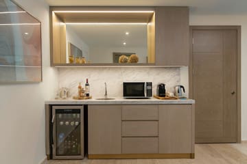 a kitchen with a sink and a refrigerator