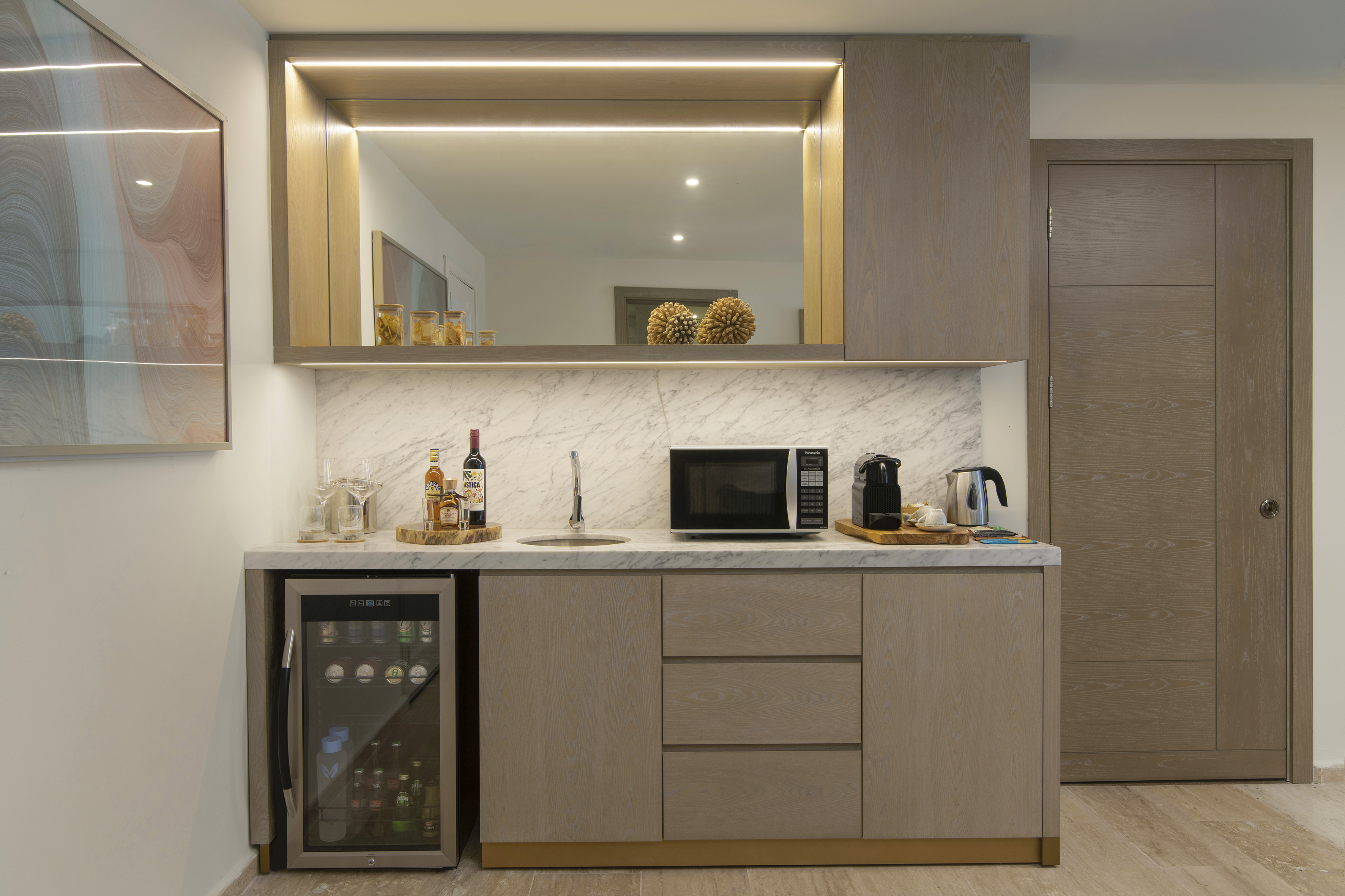a kitchen with a sink and a refrigerator