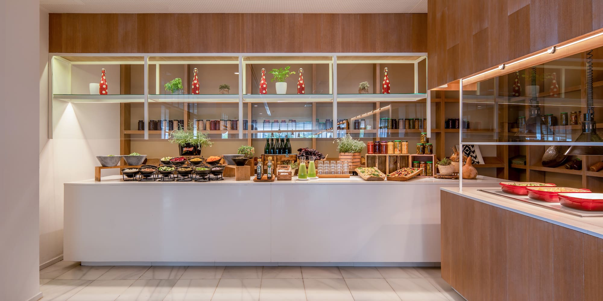 a kitchen with a counter and shelves