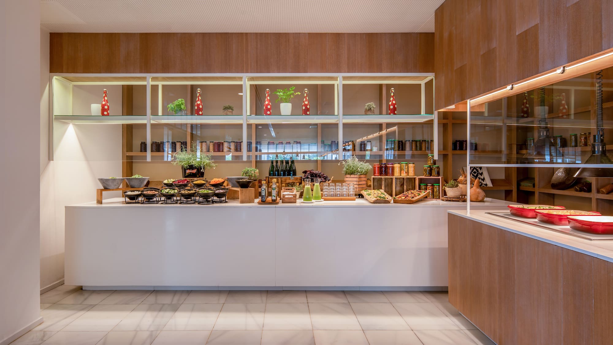 a kitchen with a counter and shelves