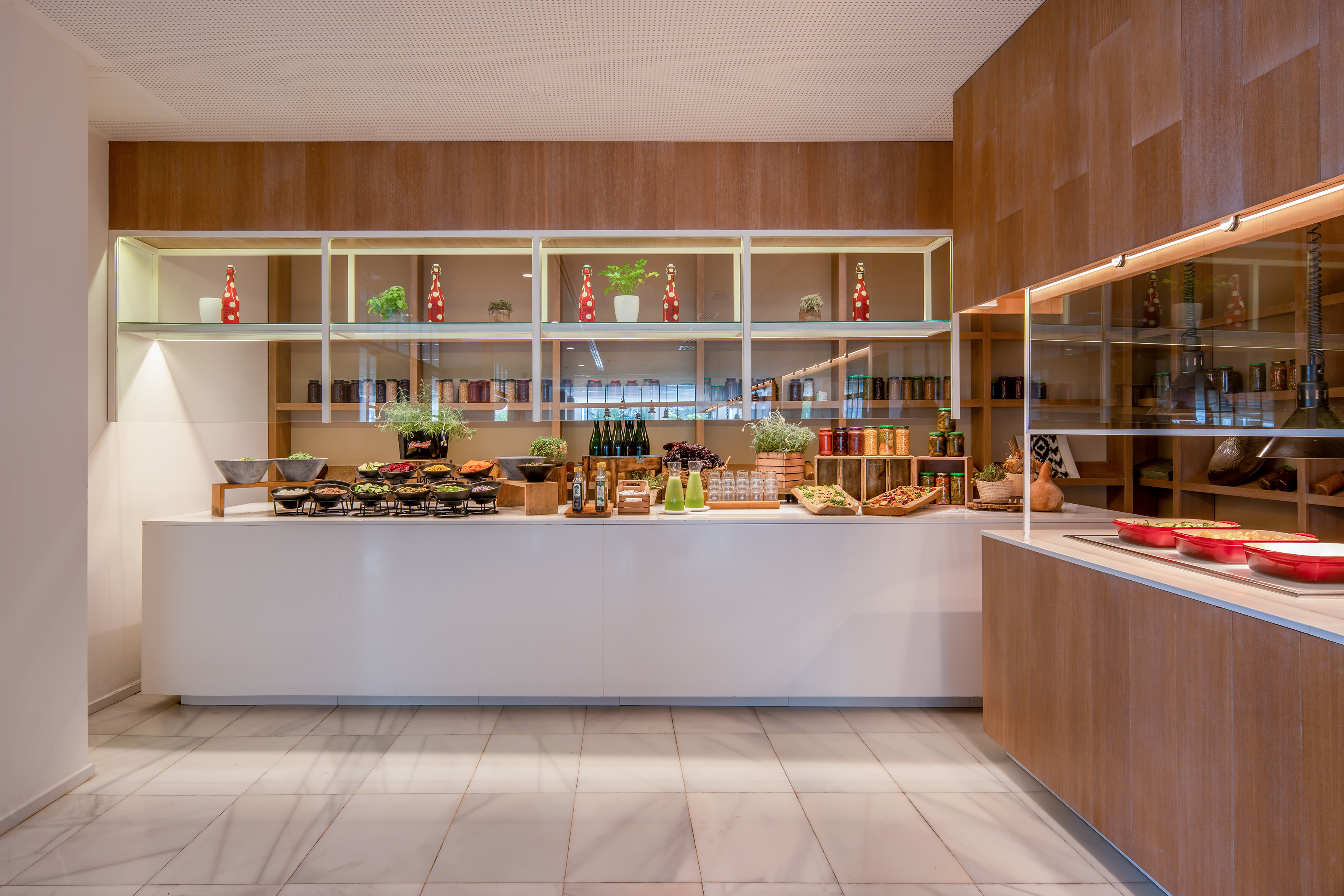 a kitchen with a counter and shelves