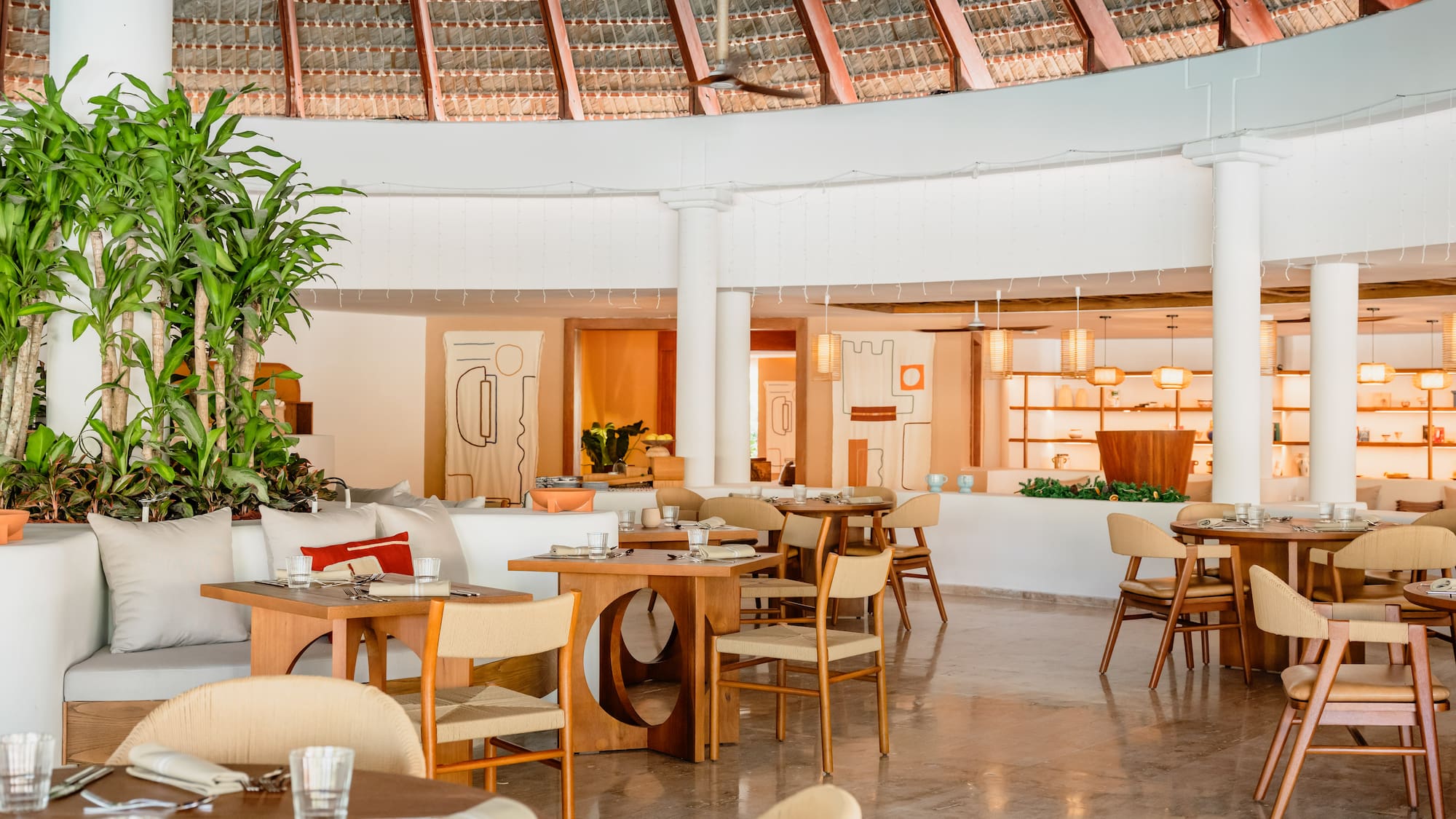 a restaurant with tables and chairs