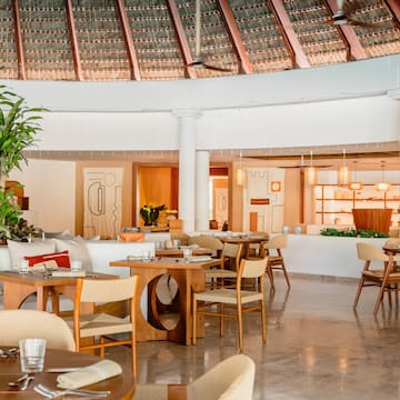 a restaurant with tables and chairs