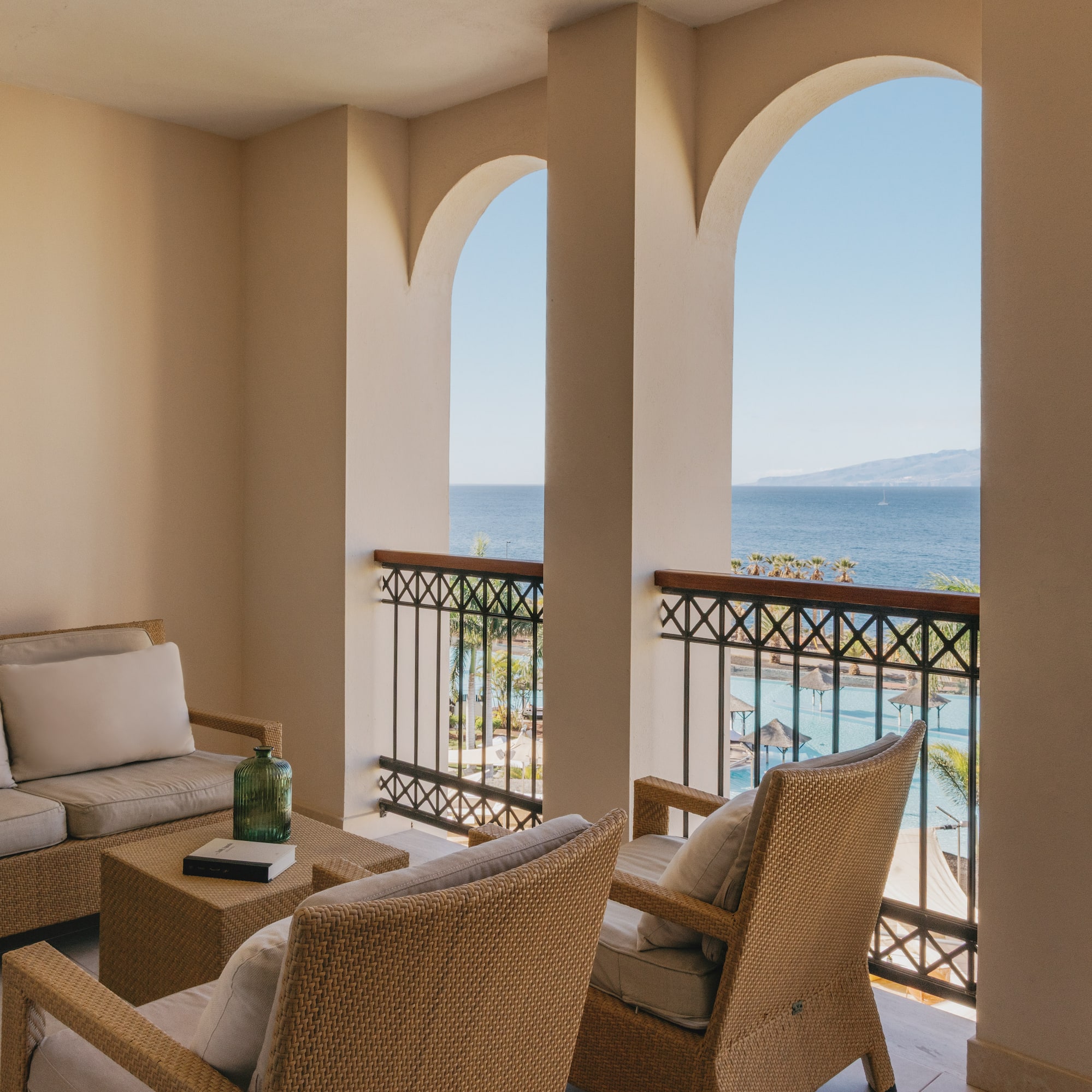 a patio with a view of the ocean