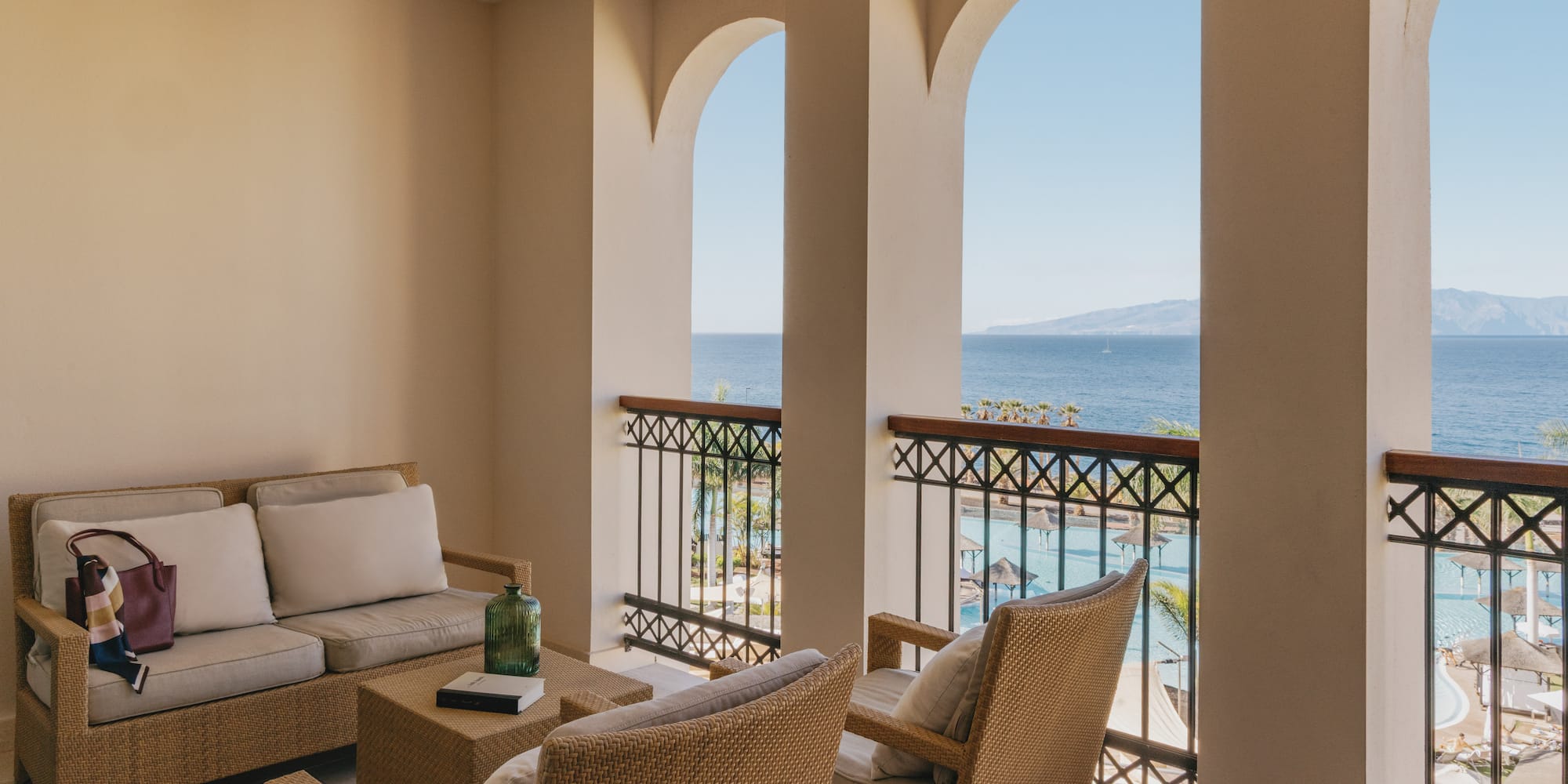 a patio with a view of the ocean
