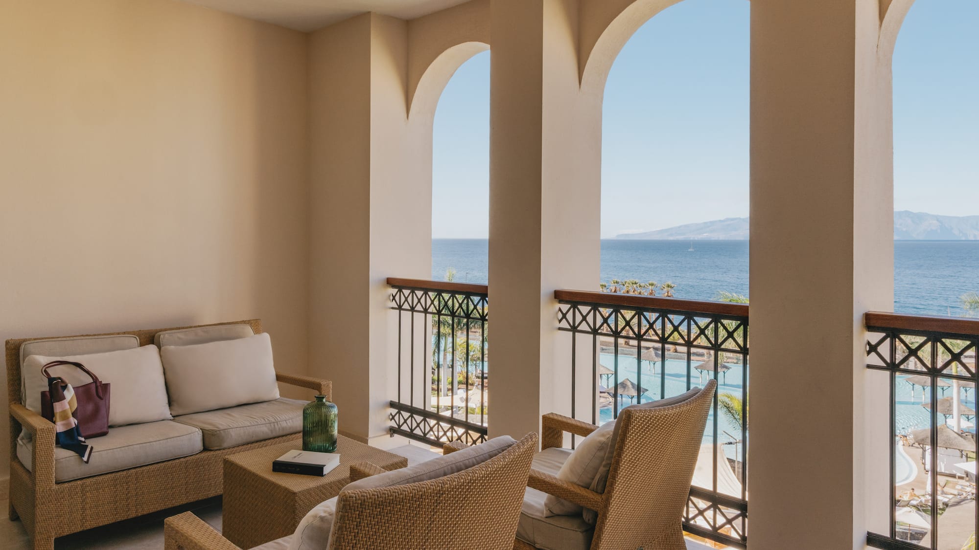 a patio with a view of the ocean