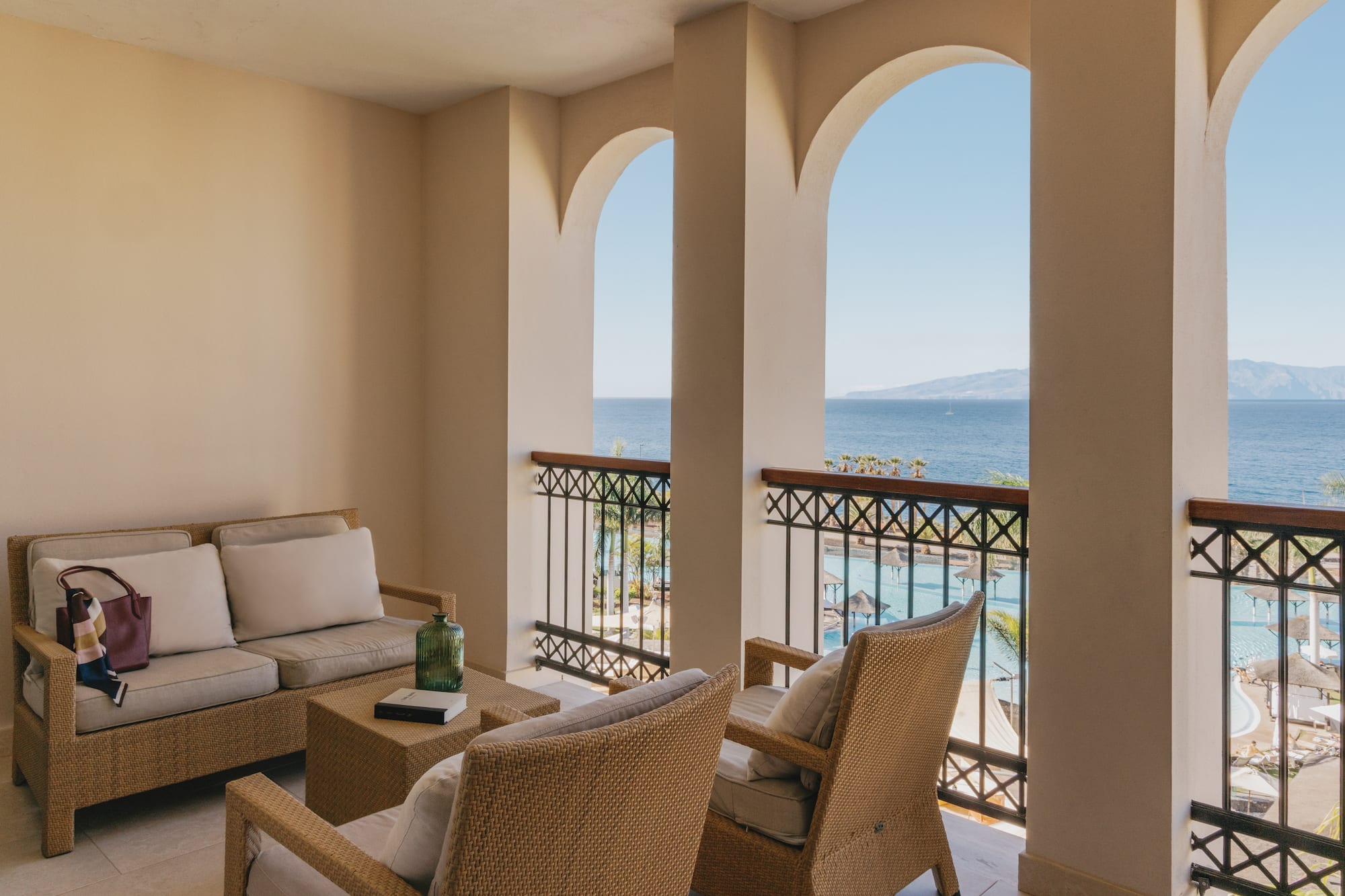 a patio with a view of the ocean