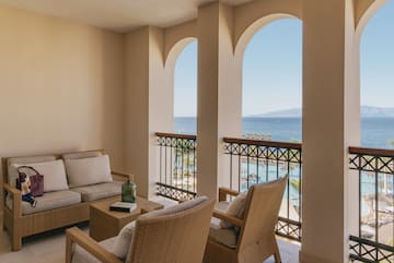a patio with a view of the ocean