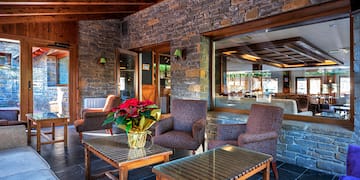 a patio with chairs and a table