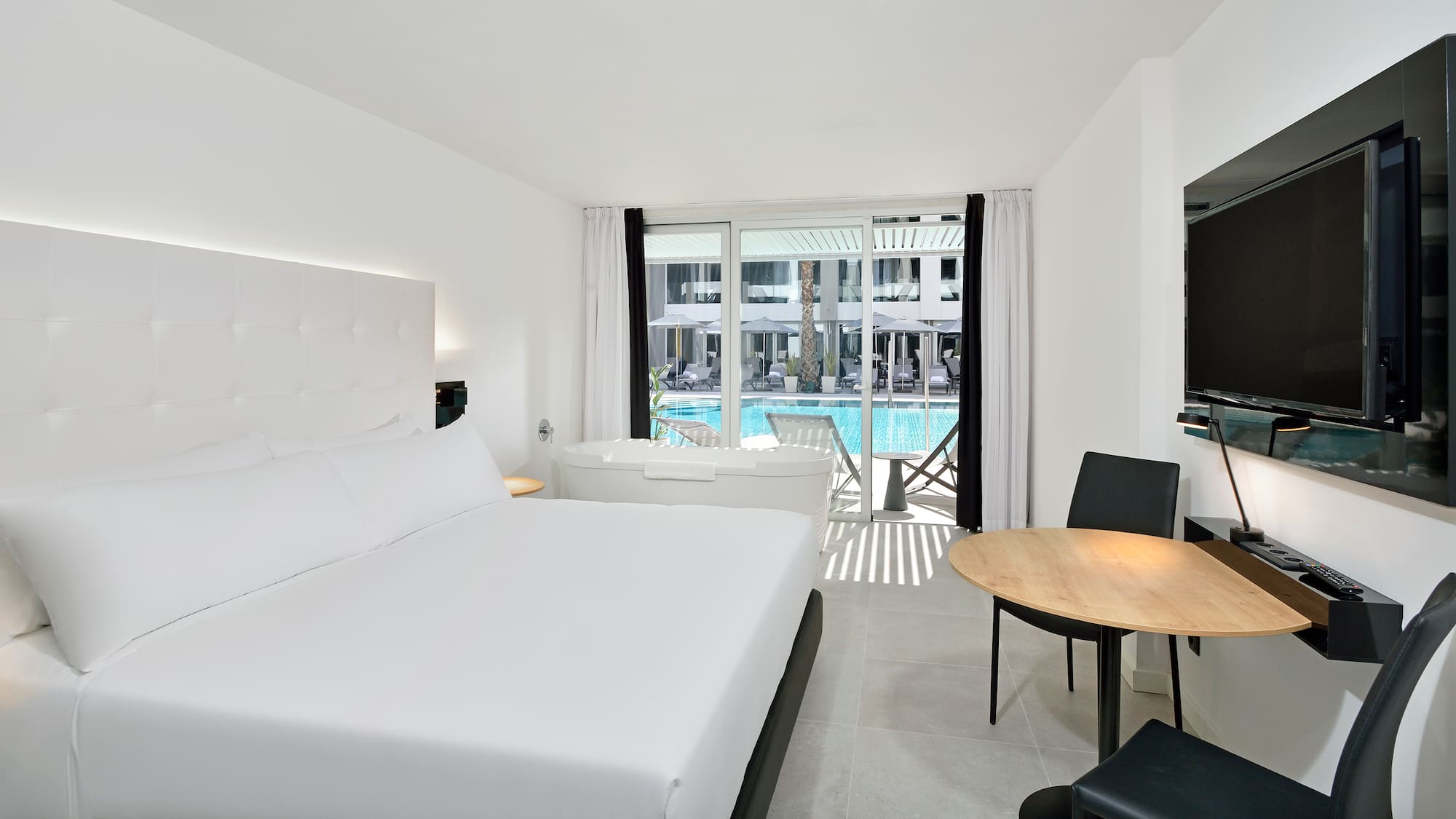 a room with a bed and a tub