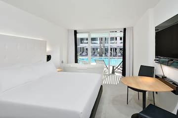 a room with a bed and a tub