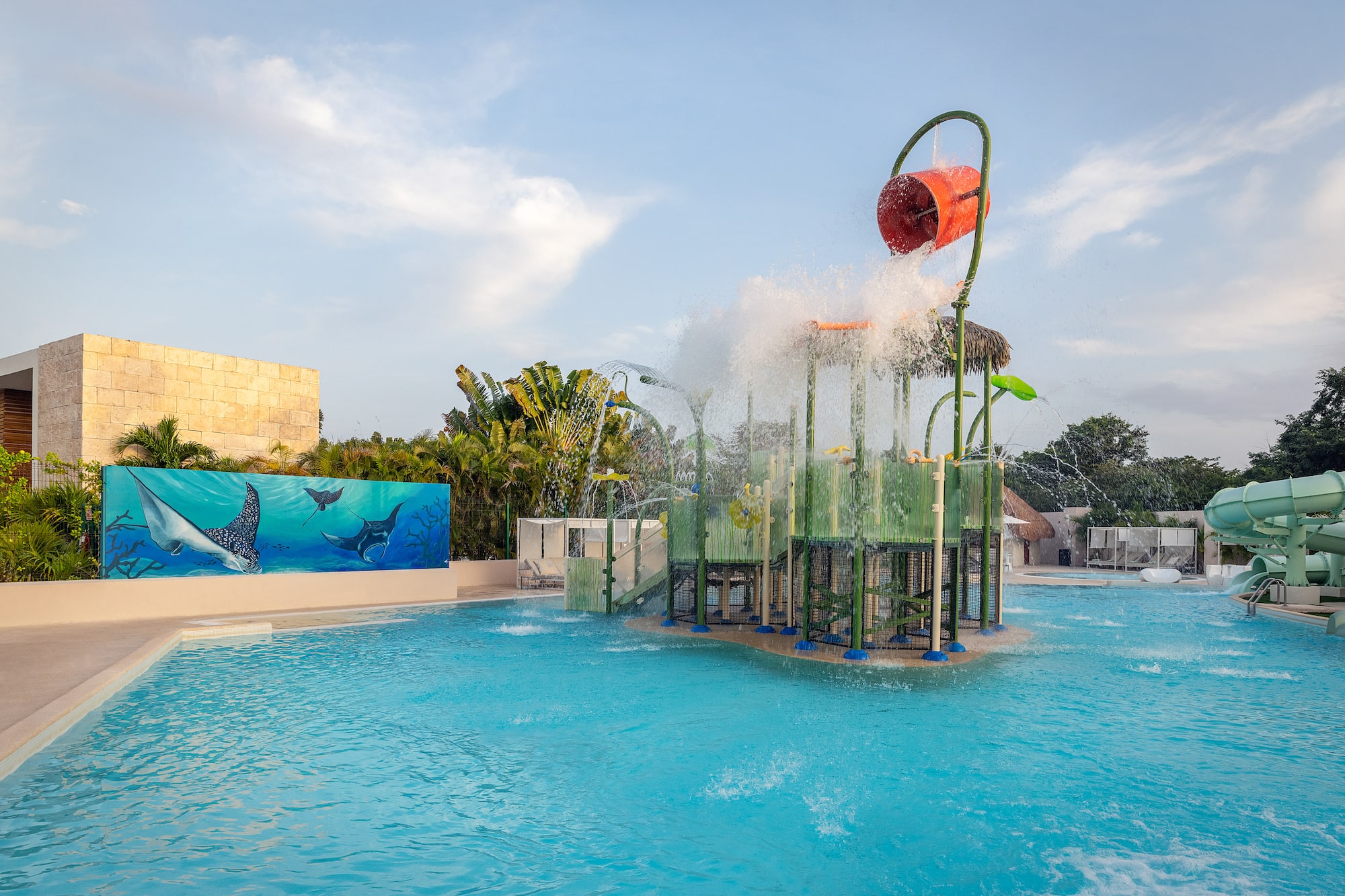 a water park with a playground and a pool