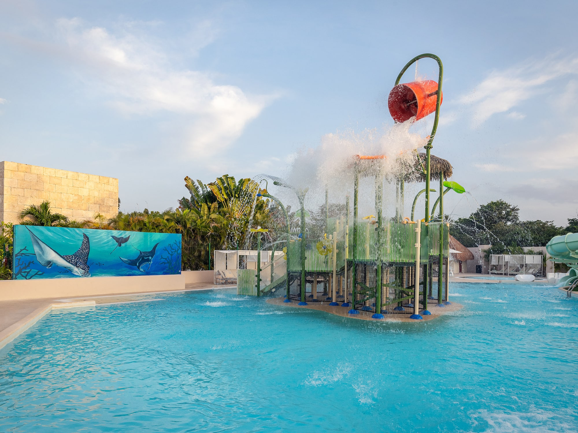 a water park with a playground and a pool