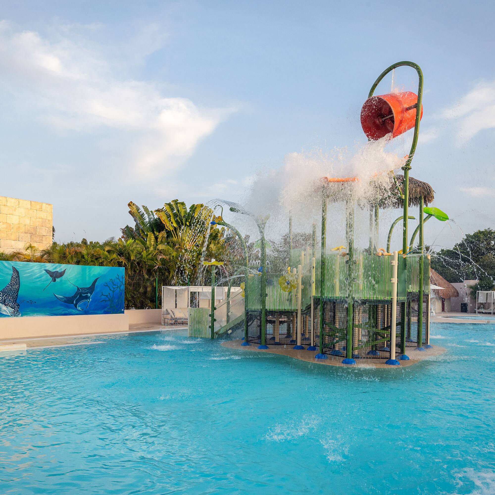 a water park with a playground and a pool