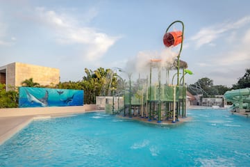 a water park with a playground and a pool