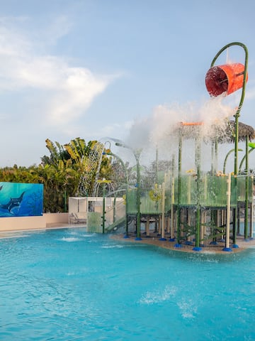 a water park with a playground and a pool