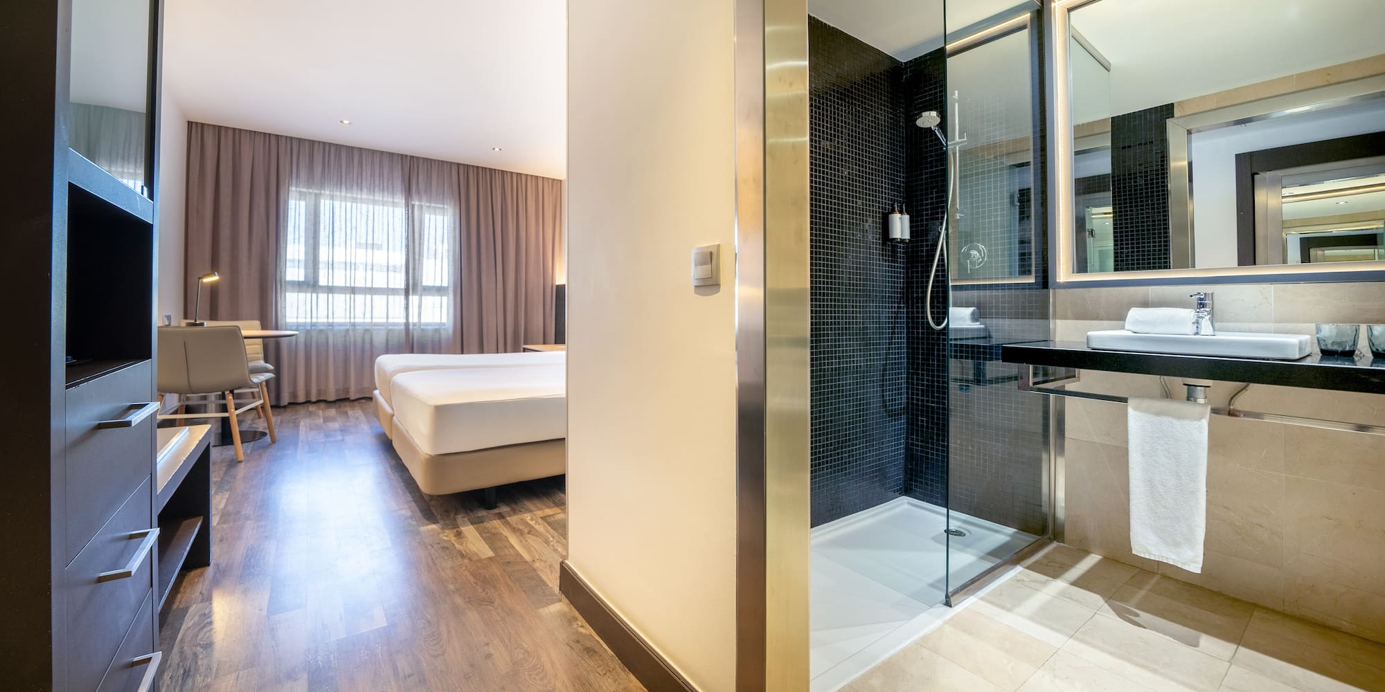 a bathroom with a shower and a bed