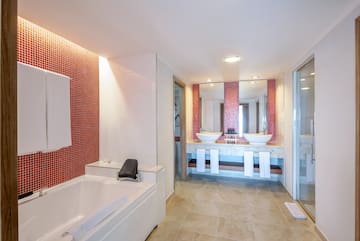 a bathroom with a bathtub and sink