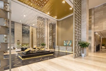 a lobby with a large black and gold floor