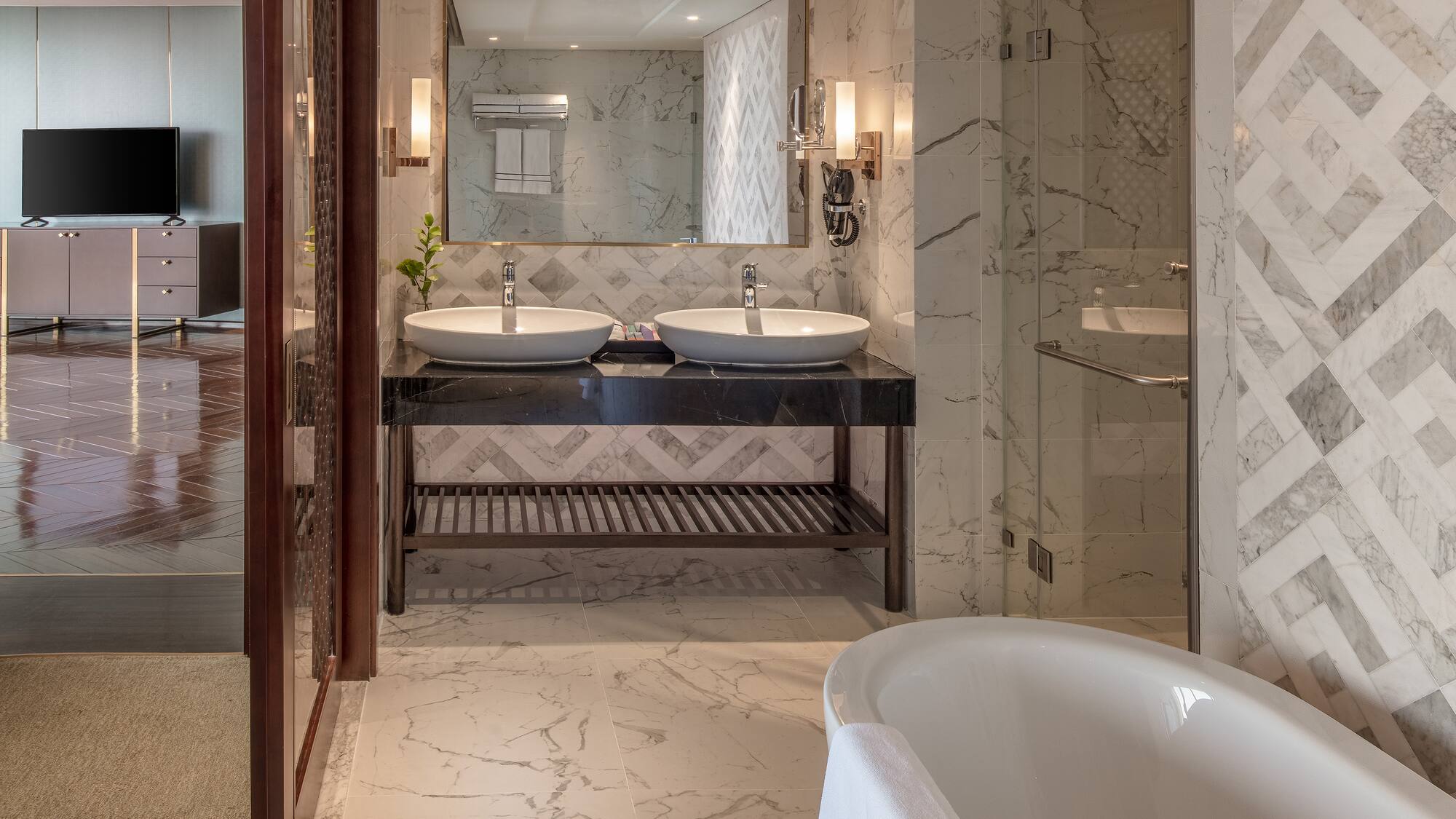 a bathroom with marble tile floor and marble countertop